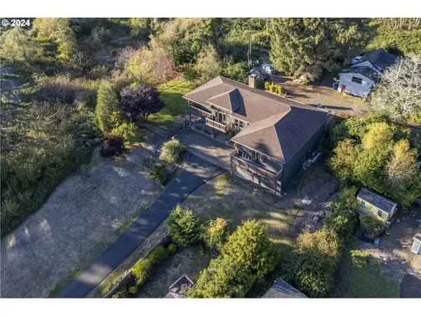 a view of house with outdoor space and garden