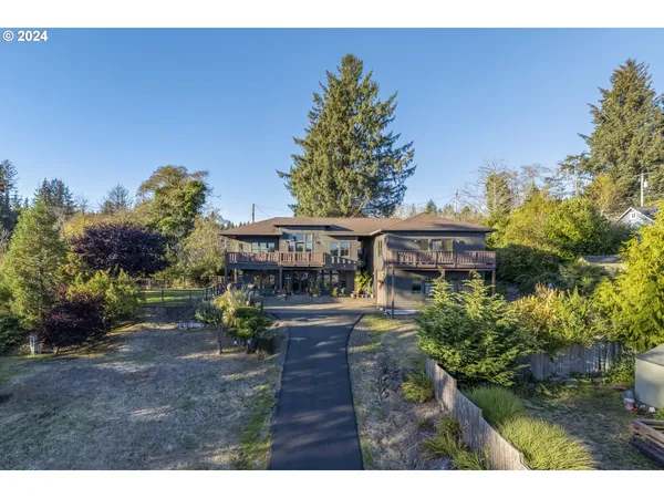 a view of house with outdoor space and sitting area