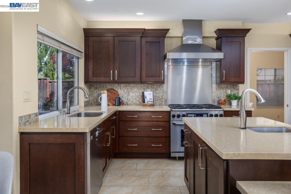 302 Sunset Drive Danville, CA 94506 - Photo 12 of 31 a kitchen with a sink a stove and a wooden cabinets
