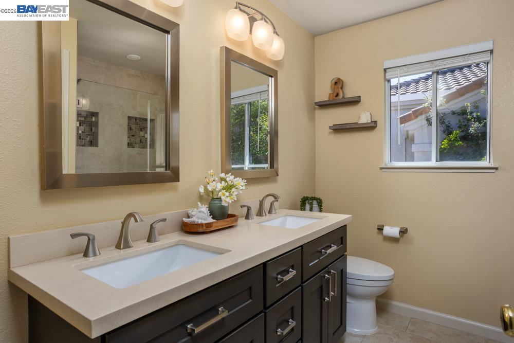302 Sunset Drive Danville, CA 94506 - Photo 23 of 31 a bathroom with a sink and a mirror