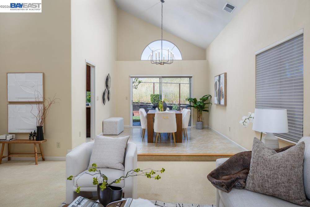 302 Sunset Drive Danville, CA 94506 - Photo 5 of 31 a living room with furniture chandelier and a large window