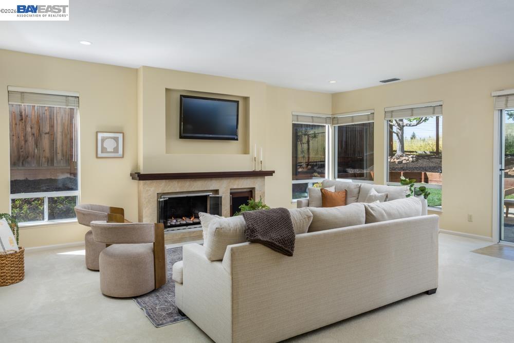 302 Sunset Drive Danville, CA 94506 - Photo 8 of 31 a living room with furniture a fireplace and a flat screen tv