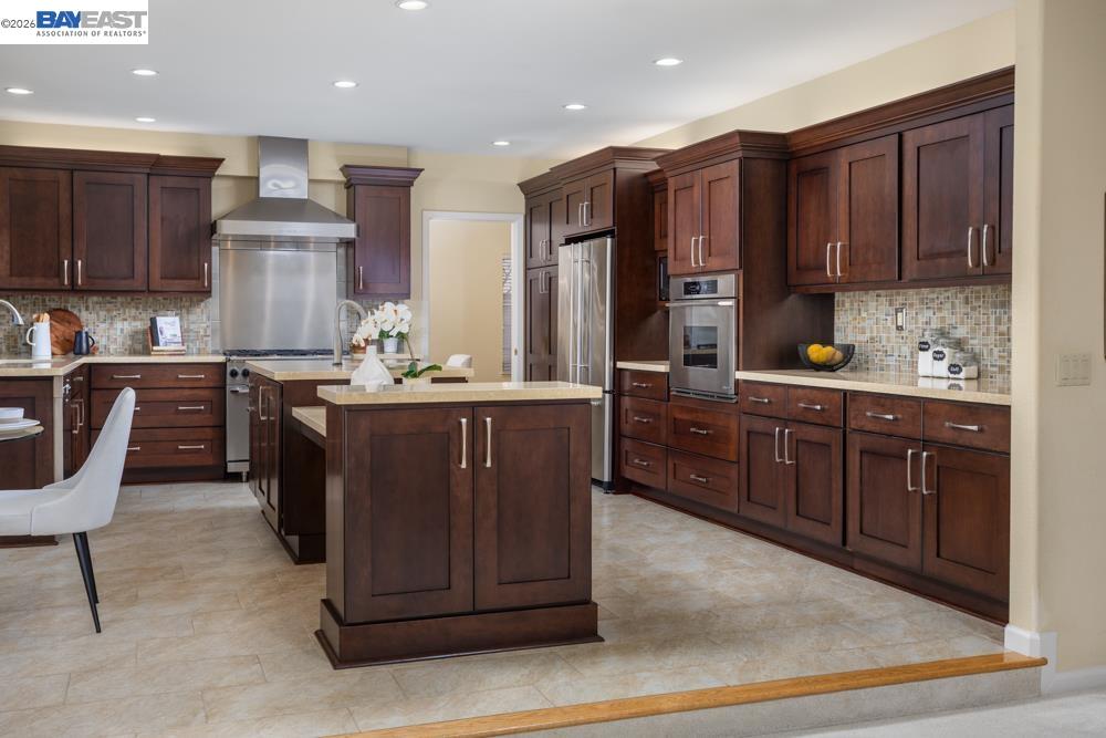 302 Sunset Drive Danville, CA 94506 - Photo 9 of 31 a kitchen with a sink and wooden cabinets