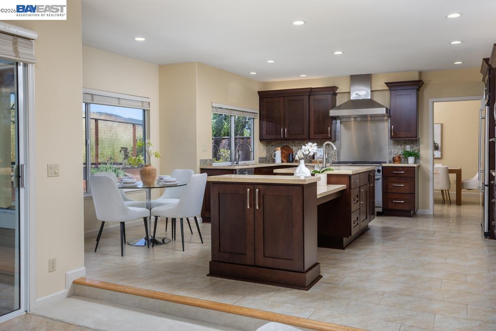 302 Sunset Drive Danville, CA 94506 - Photo 10 of 31 a kitchen with a table chairs sink and cabinets