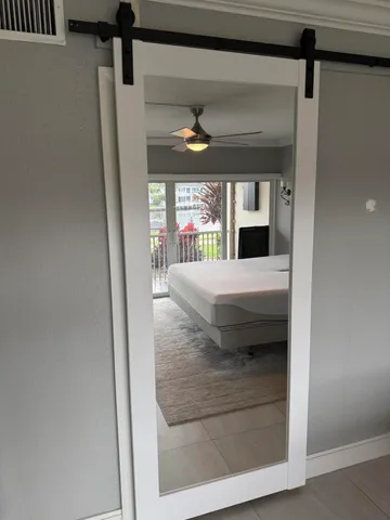 a view of a hallway with a living room