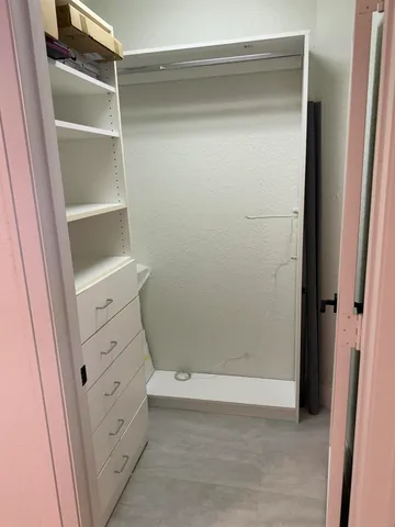 a view of an empty walk in closet