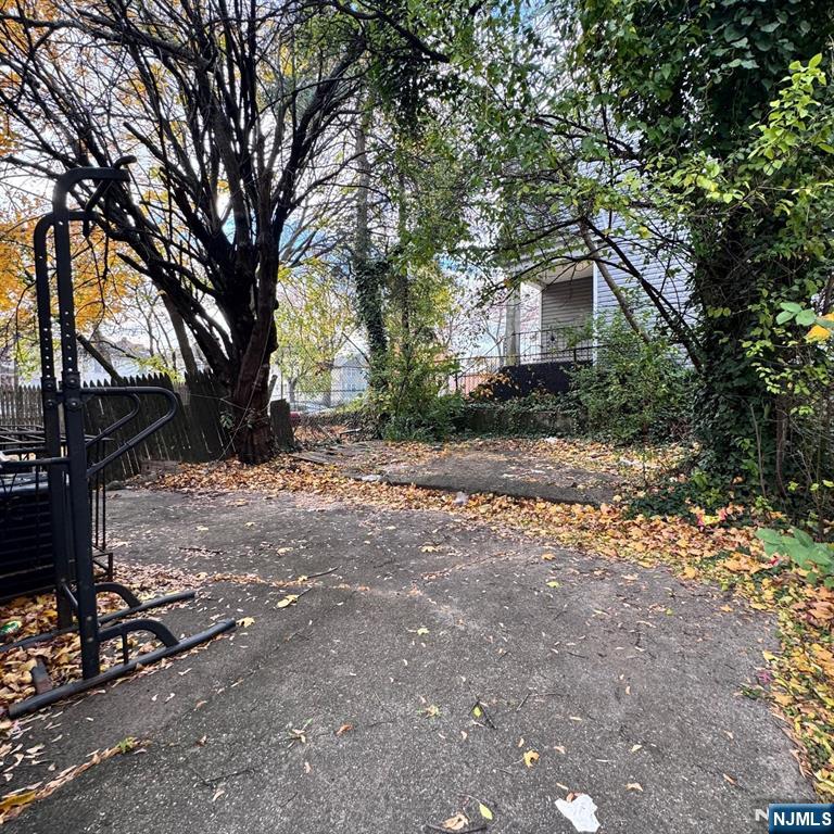 97 Clinton Place Newark, NJ 07108 - Photo 8 of 9 a view of a house with a yard