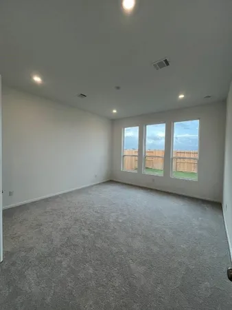 a kitchen with stainless steel appliances granite countertop a stove a refrigerator and a sink