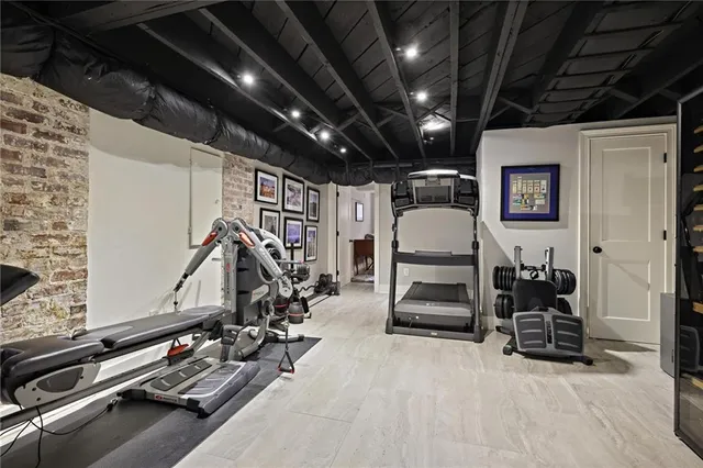 a bedroom with a bed and a lamp