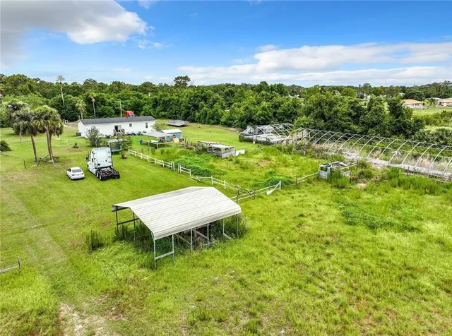 a view of a golf course with chairs