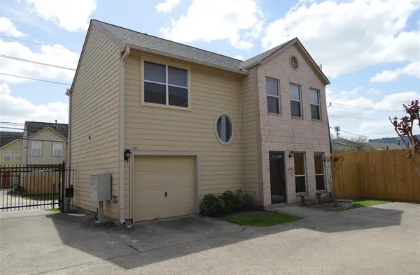 a front view of a house with a garage