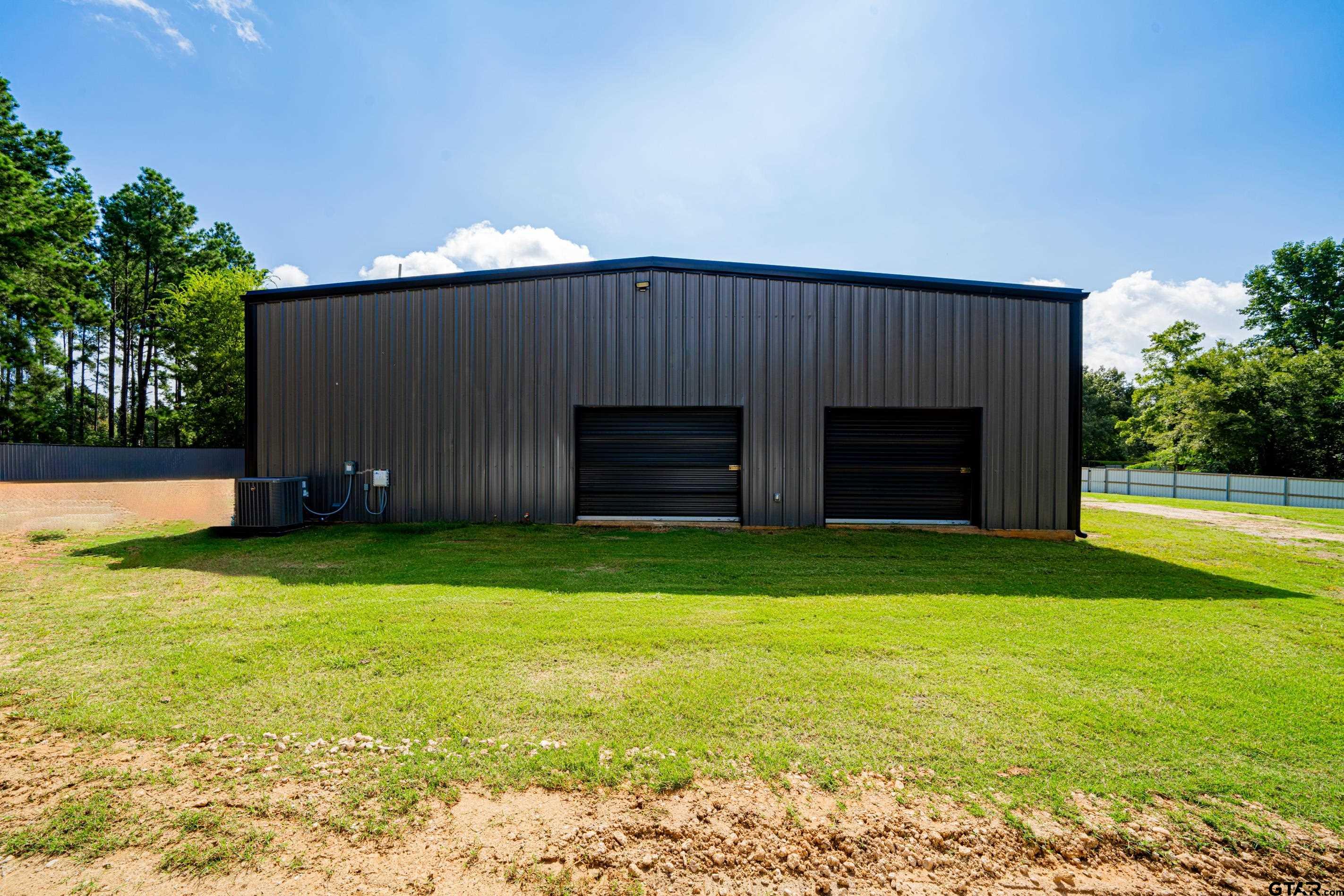 126 Gamel Road Longview, TX 75604 - Photo 22 of 23 a view of a backyard with a garden