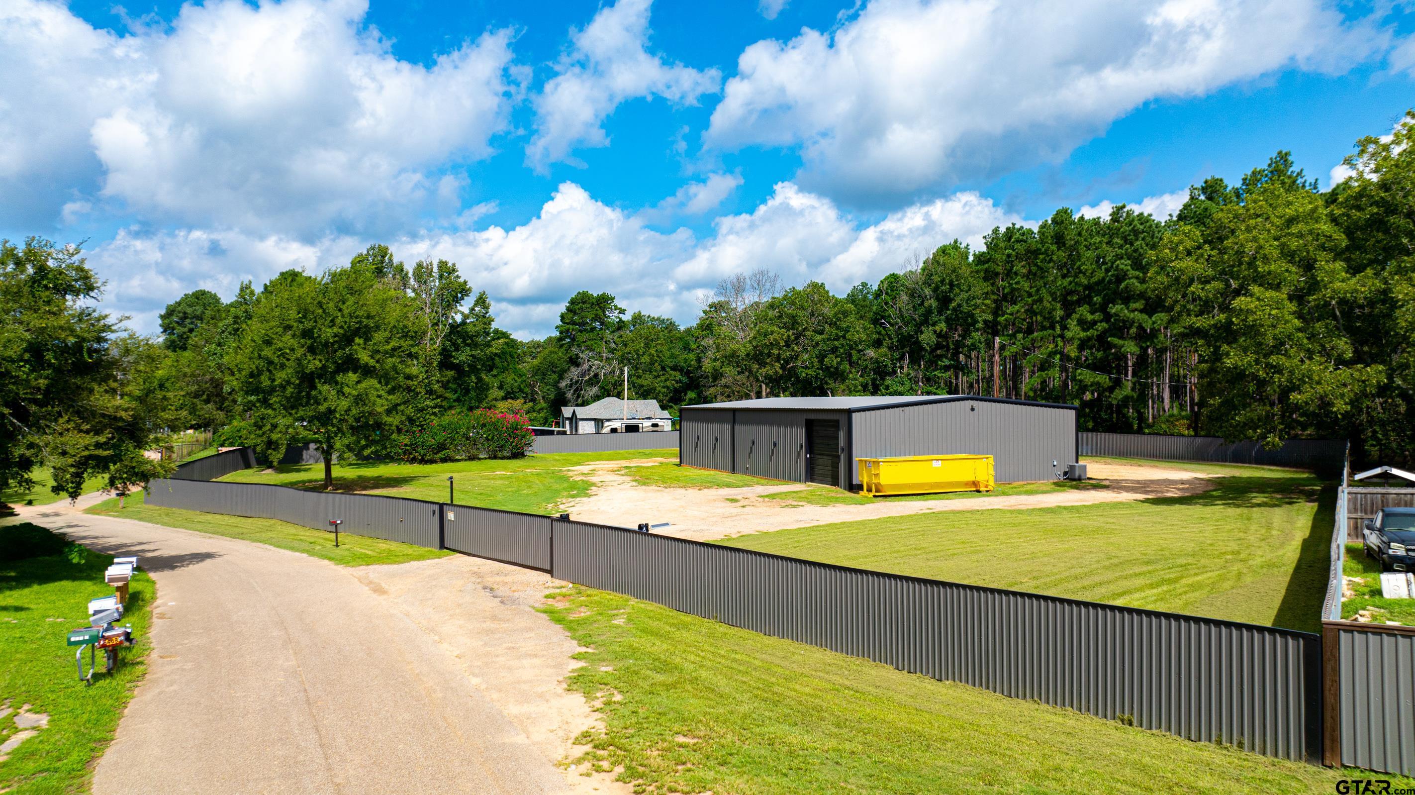 126 Gamel Road Longview, TX 75604 - Photo 10 of 23 a view of a swimming pool with an outdoor seating and yard