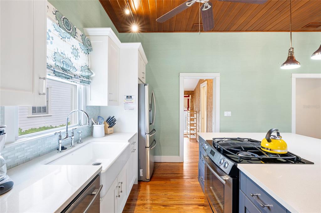 340 Palm Avenue Boca Grande, FL 33921 - Photo 13 of 38 a kitchen with a stove and a sink