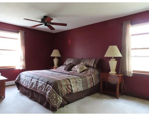 194 Root Road Barre, MA 01005 - Photo 13 of 25 a bedroom with a bed large window and couch