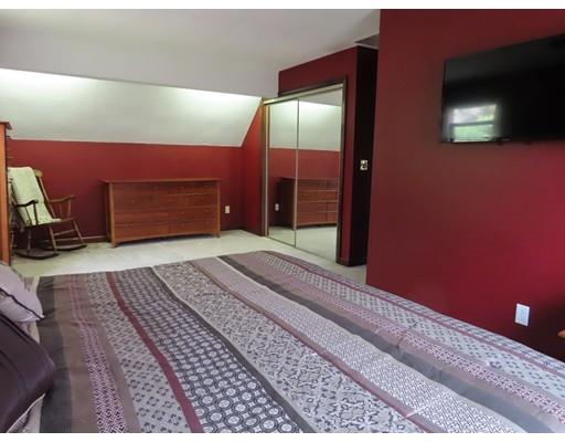 194 Root Road Barre, MA 01005 - Photo 14 of 25 a bedroom with a bed and a flat screen tv