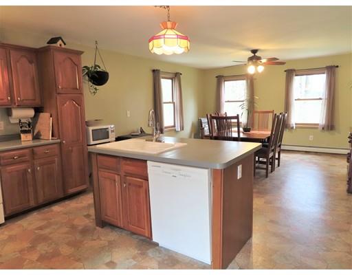 194 Root Road Barre, MA 01005 - Photo 5 of 25 a kitchen with kitchen island granite countertop a sink cabinets and wooden floor