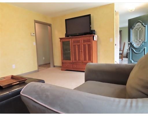 194 Root Road Barre, MA 01005 - Photo 9 of 25 a bedroom with a bed and flat screen tv