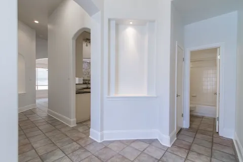 a view of a bathroom with sink and shower