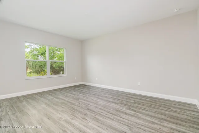a view of a bathroom with a shower and a sink