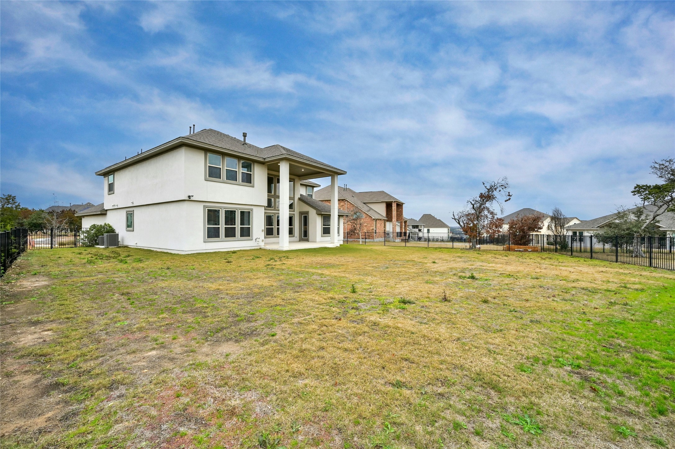 4124 Florentine Road Leander, TX 78641 - Photo 32 of 37 Back of house featuring a lawn and cooling unit