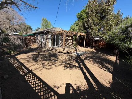 a view of a roof deck with wooden fence