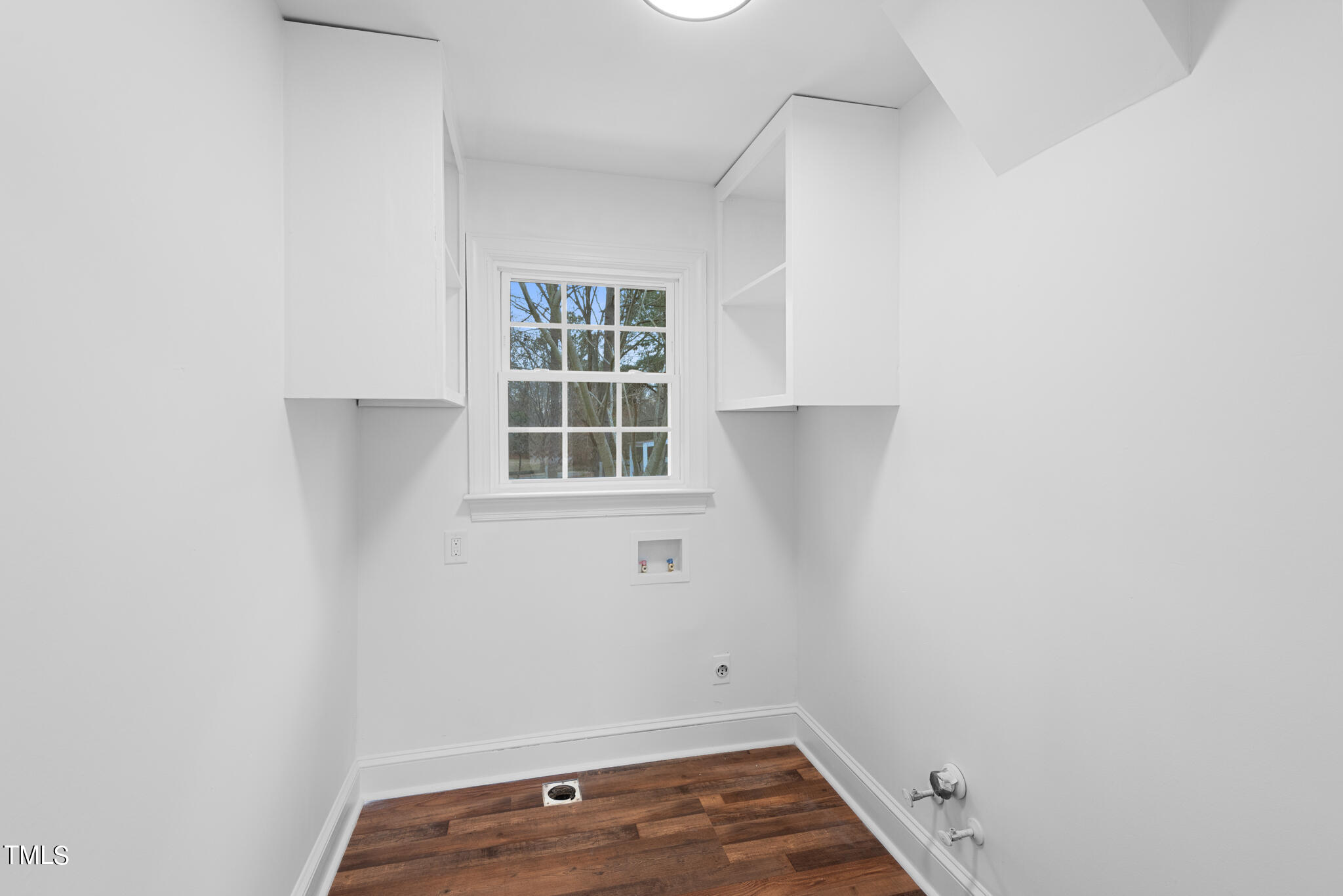 3012 Old Crews Road Raleigh, NC 27616 - Photo 14 of 34 a view of small space with wooden floor and cabinets