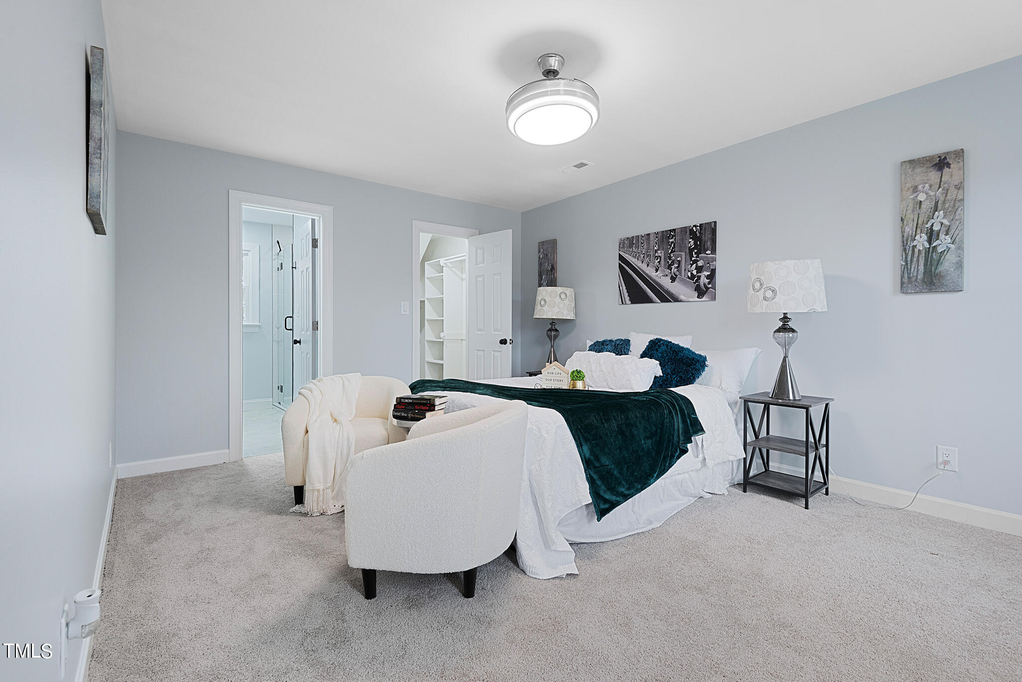 3012 Old Crews Road Raleigh, NC 27616 - Photo 17 of 34 a bedroom with a bed and a chandelier