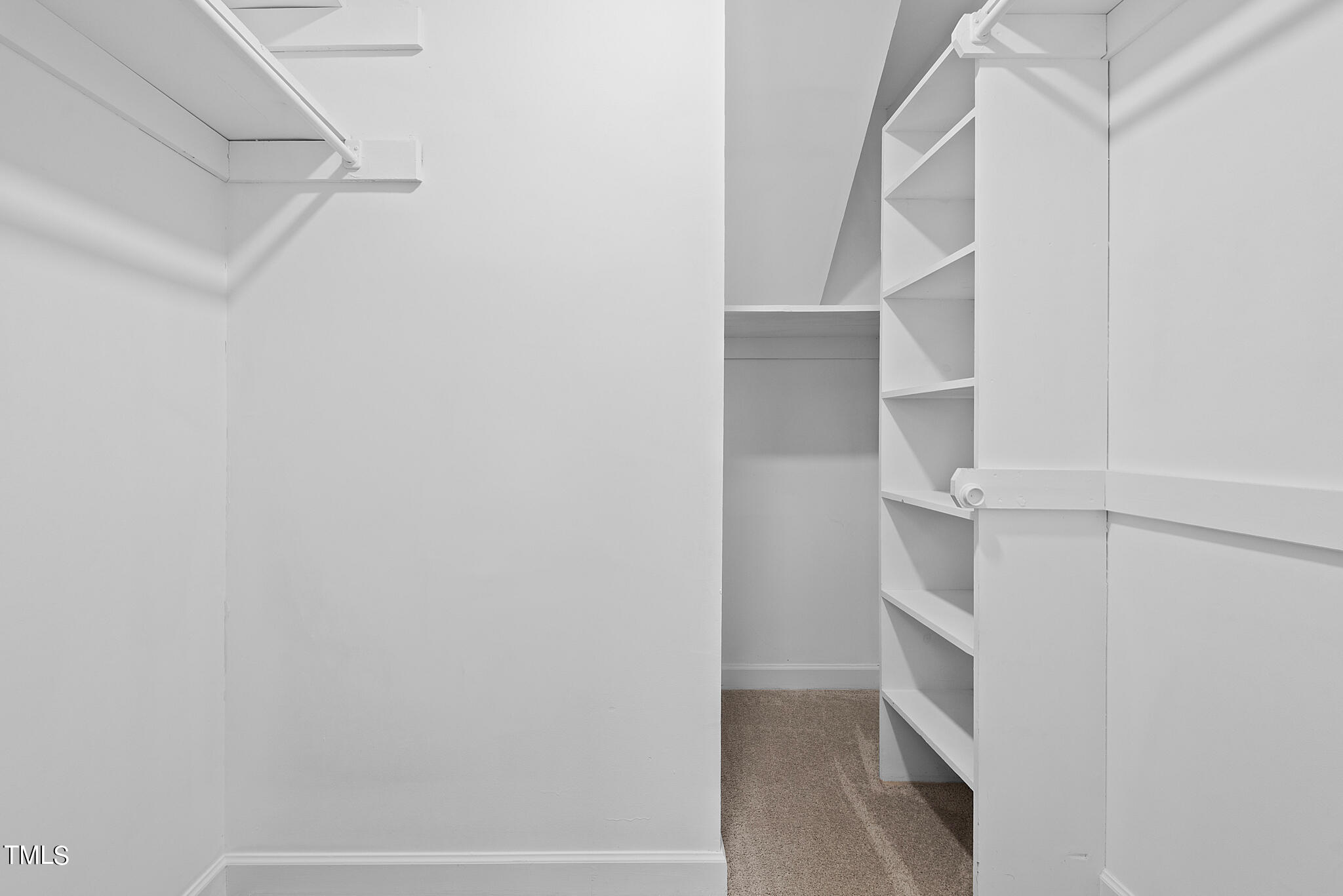 3012 Old Crews Road Raleigh, NC 27616 - Photo 21 of 34 a view of walk in closet with empty racks