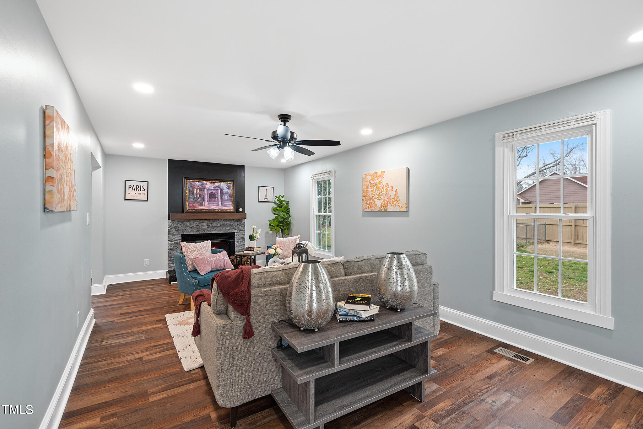 3012 Old Crews Road Raleigh, NC 27616 - Photo 5 of 34 a living room with furniture a flat screen tv and a window