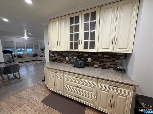 a kitchen with stainless steel appliances granite countertop a stove a sink and a granite counter tops