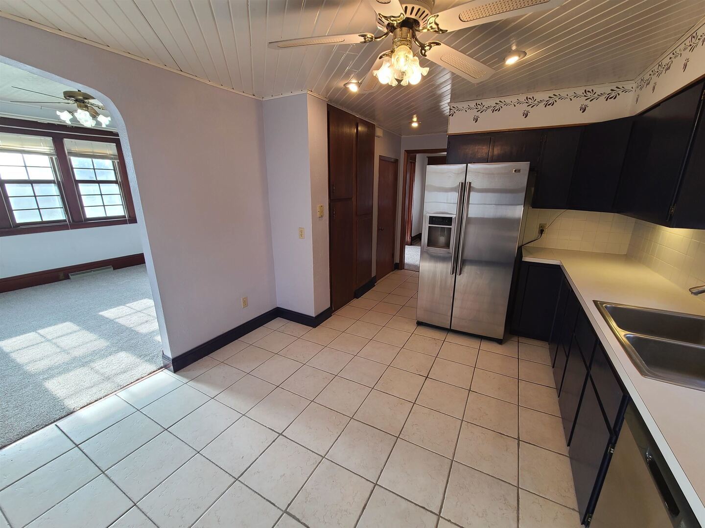 423 South Grove Street Walcott, IA 52773 - Photo 12 of 30 a kitchen with stainless steel appliances granite countertop a refrigerator a sink and a stove
