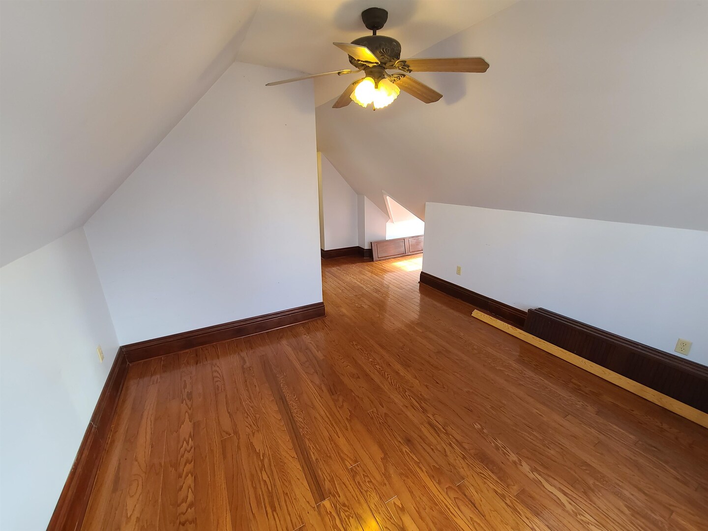 423 South Grove Street Walcott, IA 52773 - Photo 13 of 30 a view of empty room with wooden floor