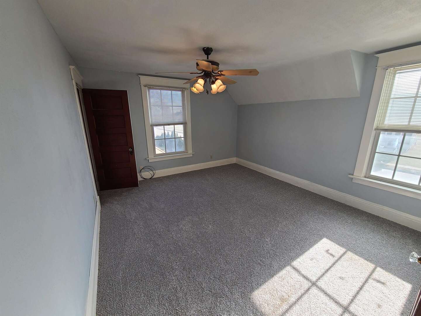 423 South Grove Street Walcott, IA 52773 - Photo 18 of 30 wooden floor in an empty room with a window