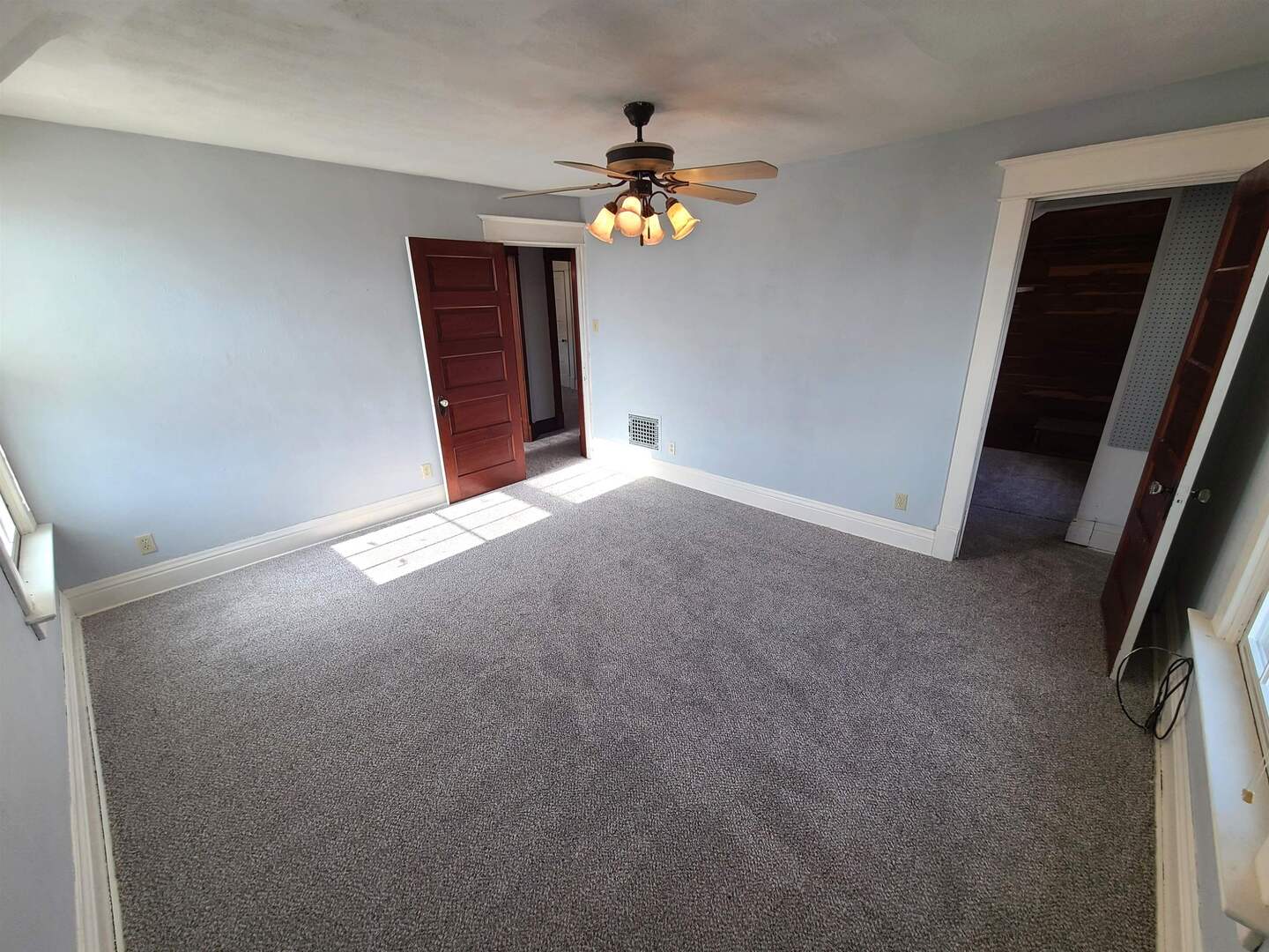 423 South Grove Street Walcott, IA 52773 - Photo 19 of 30 a view of an empty room with a window