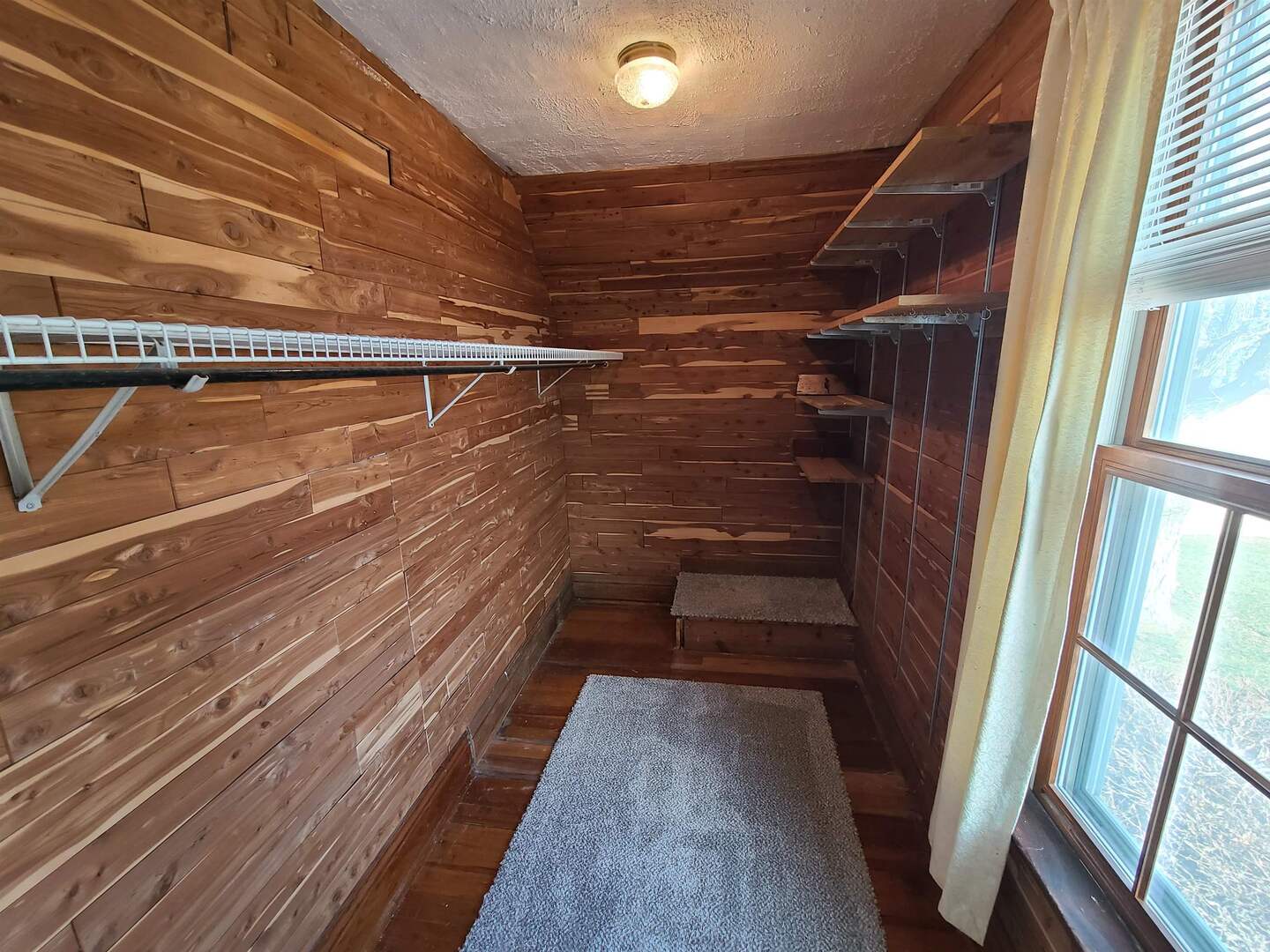 423 South Grove Street Walcott, IA 52773 - Photo 20 of 30 a view of walk in closet with wooden floor
