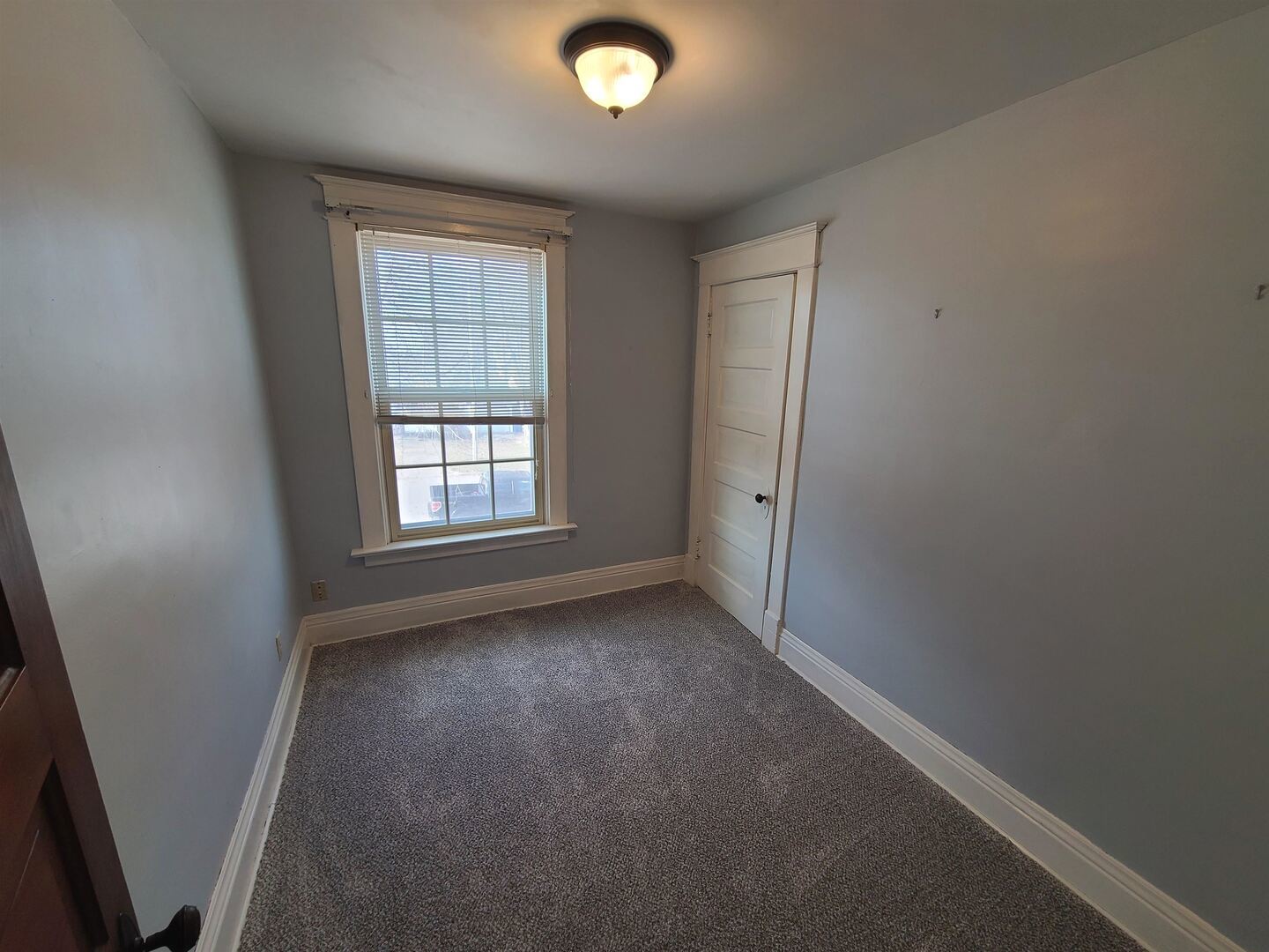 423 South Grove Street Walcott, IA 52773 - Photo 23 of 30 an empty room with windows and closet