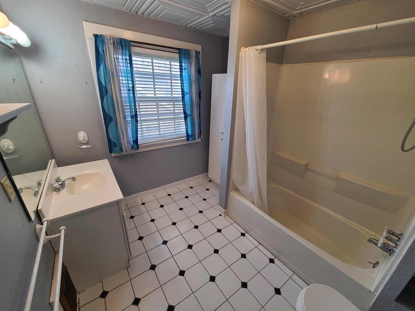 423 South Grove Street Walcott, IA 52773 - Photo 26 of 30 a bathroom with a bathtub and shower