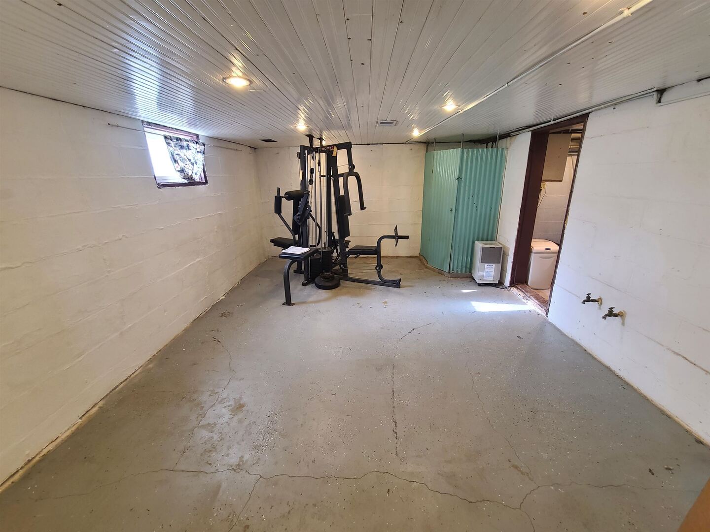 423 South Grove Street Walcott, IA 52773 - Photo 29 of 30 a view of a room with gym equipment