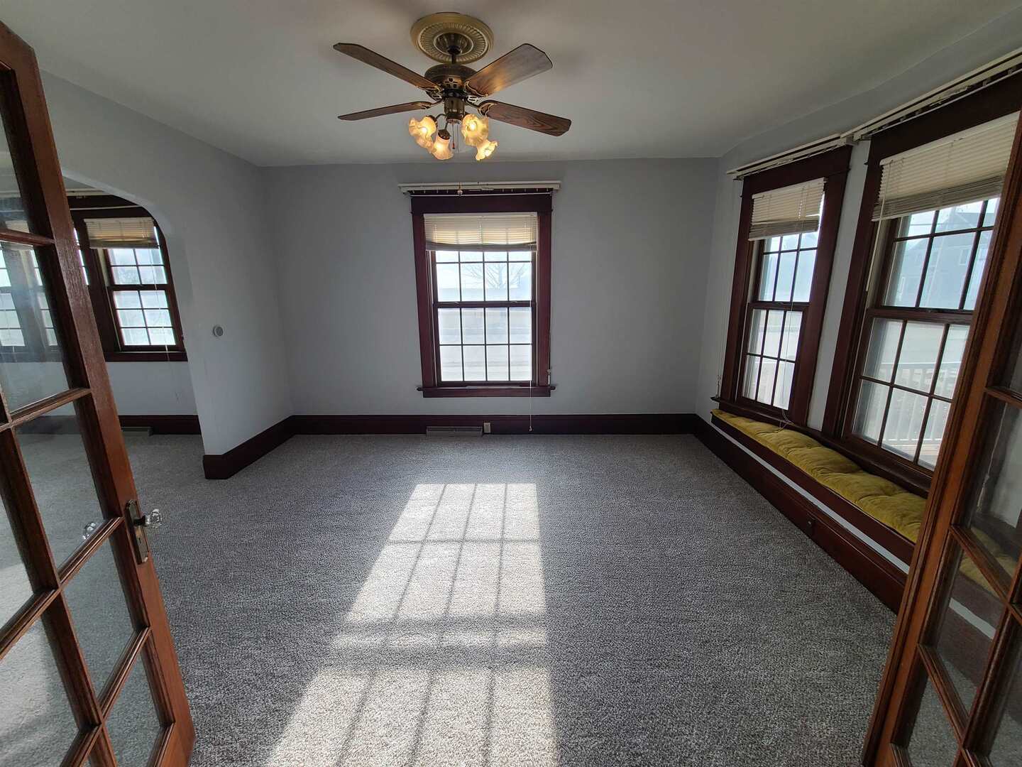423 South Grove Street Walcott, IA 52773 - Photo 7 of 30 a view of an empty room and window