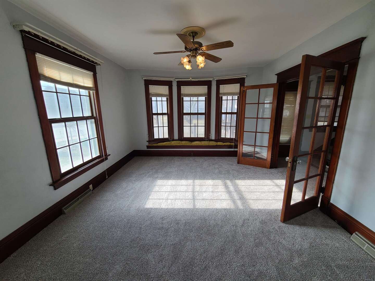 423 South Grove Street Walcott, IA 52773 - Photo 8 of 30 a view of an empty room with a window