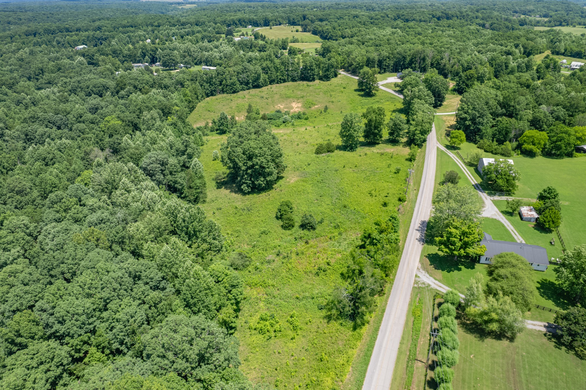 0 Mobley Ridge Road Duck River, TN 38454 - Photo 10 of 35 a view of a garden with an houses