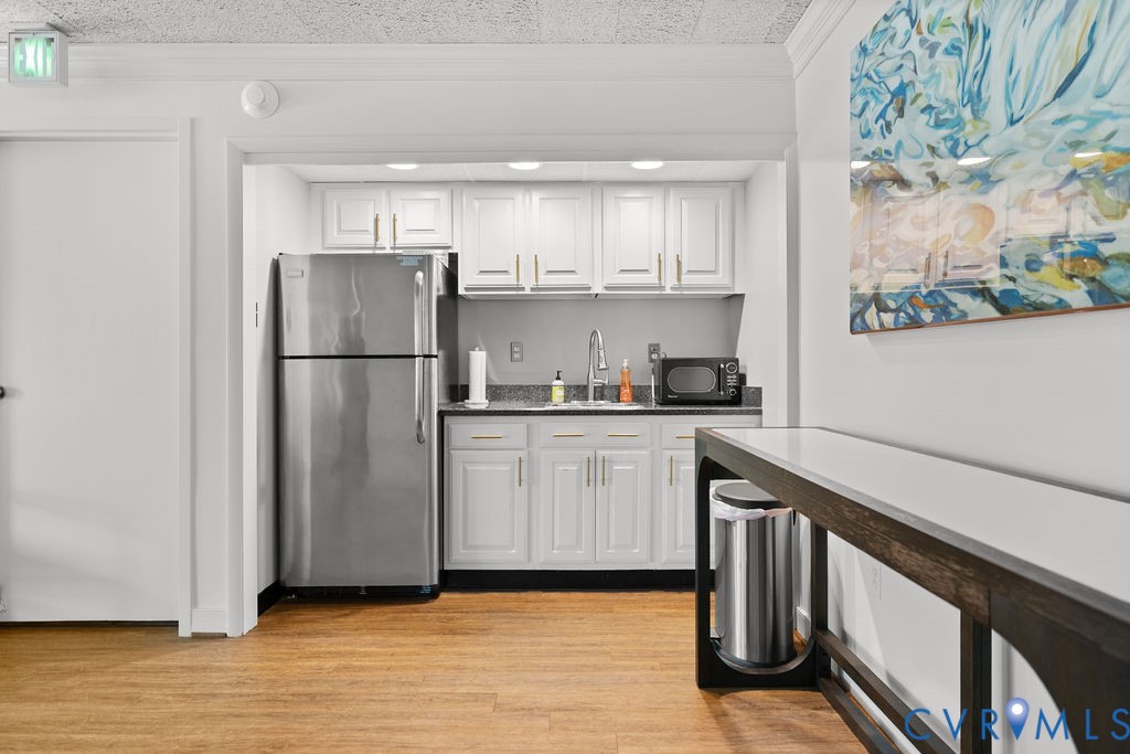2956 Hathaway Road, Unit U704 Richmond, VA 23225 - Photo 34 of 42 Compact kitchenette featuring white cabinetry with