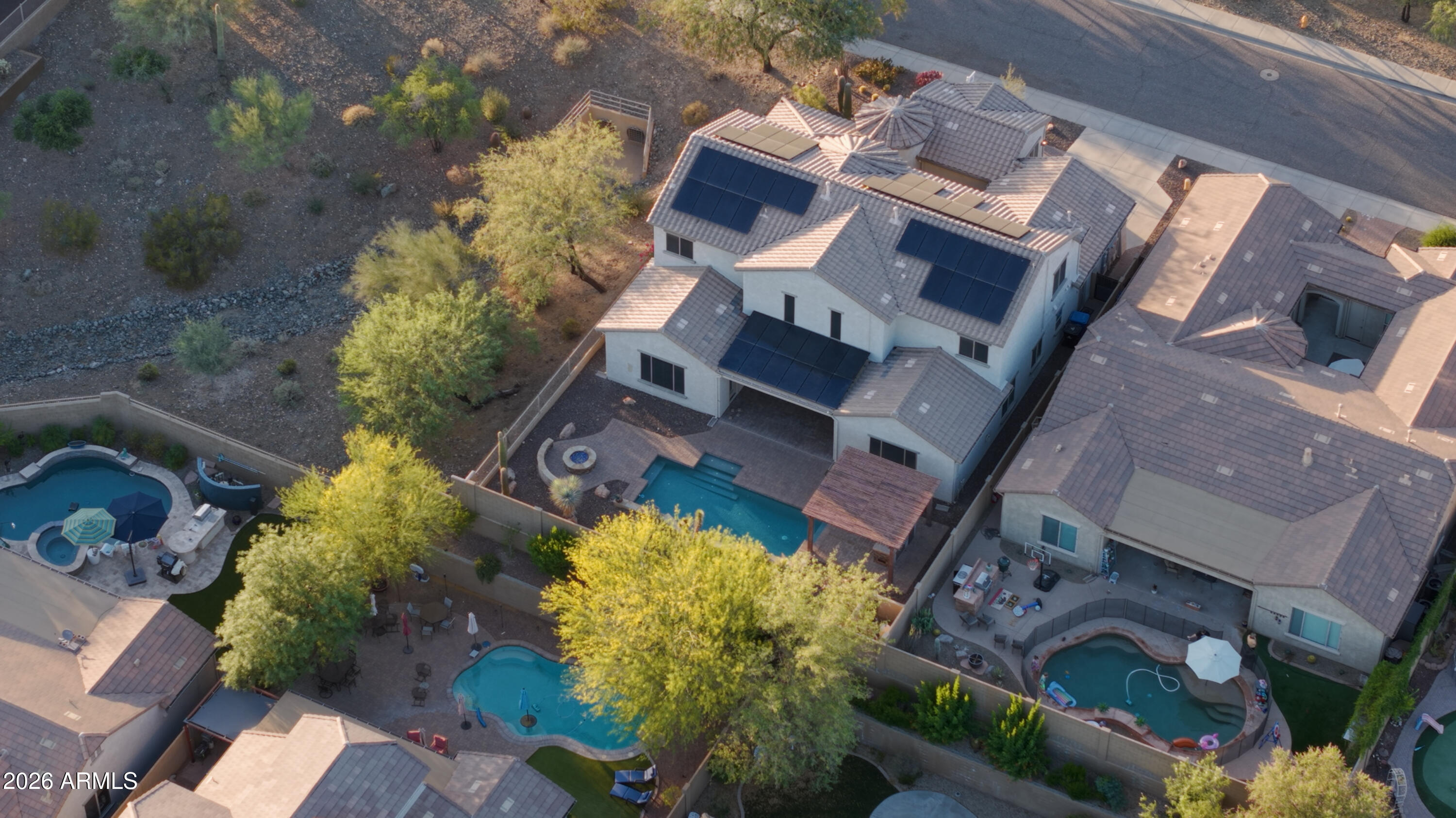1615 West Red Fox Road Phoenix, AZ 85085 - Photo 45 of 64 an aerial view of a house with a yard and garden