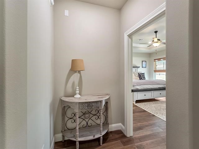 14845 Norma Jane Lane Beaumont, TX 77713 - Photo 12 of 35 a view of a hallway with wooden floor and a bathroom