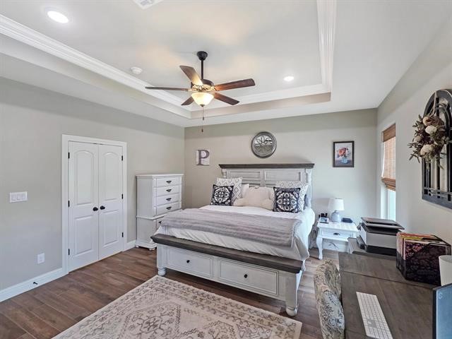 14845 Norma Jane Lane Beaumont, TX 77713 - Photo 14 of 35 a bedroom with a bed and a ceiling fan