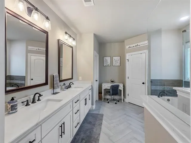 a bathroom with a bathtub and a shower
