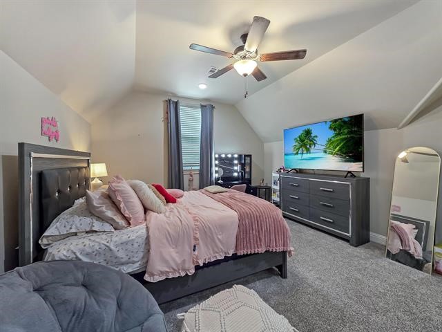 14845 Norma Jane Lane Beaumont, TX 77713 - Photo 21 of 35 a bedroom with a large bed and a flat tv screen on dresser
