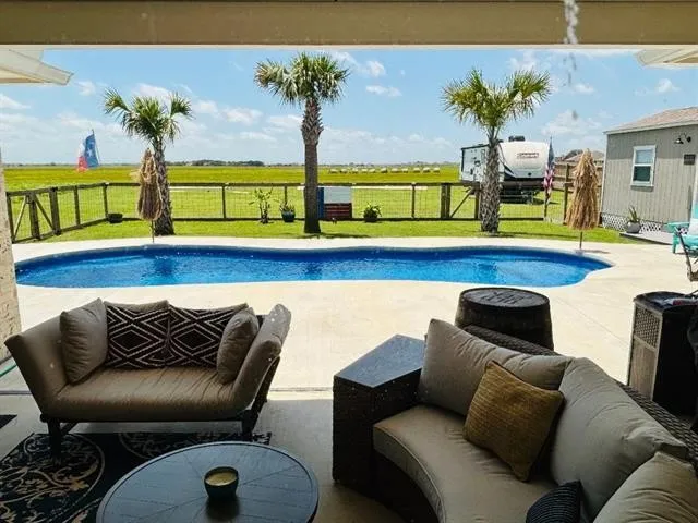 a backyard of a house with table and chairs