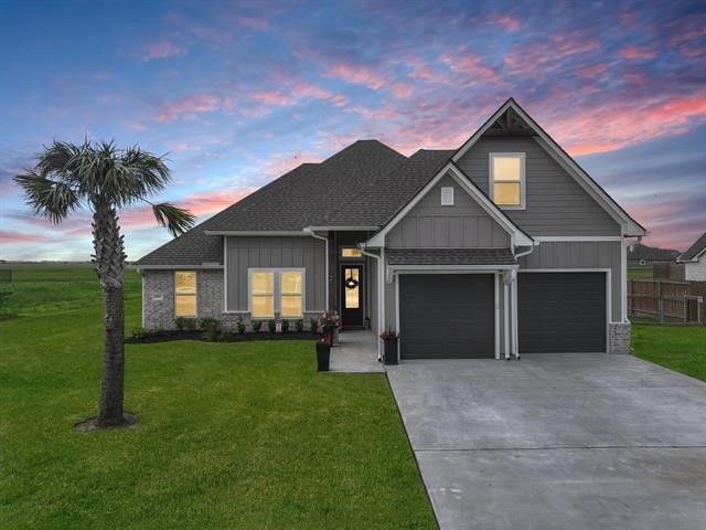 14845 Norma Jane Lane Beaumont, TX 77713 - Photo 35 of 35 a front view of a house with a garden and yard